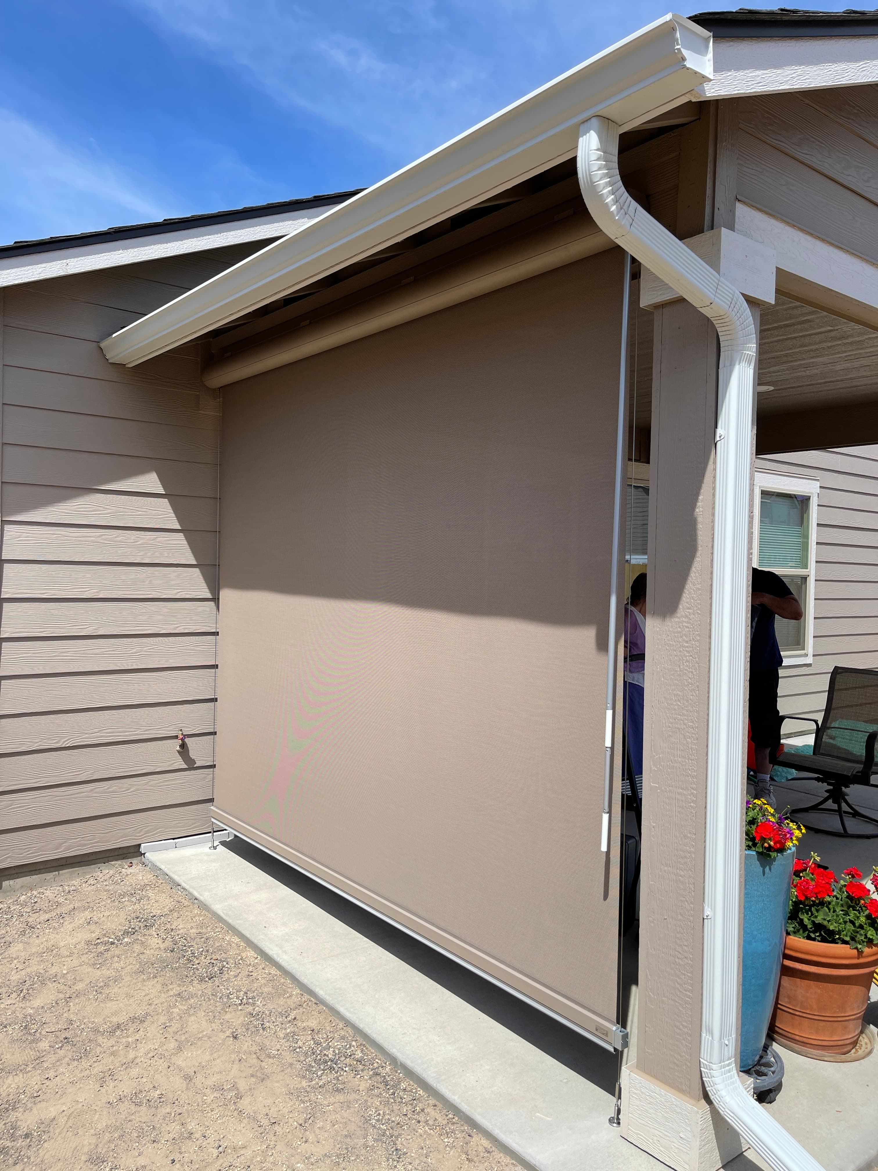 Exterior solar shade install on a North Idaho home by Luxe Window Works