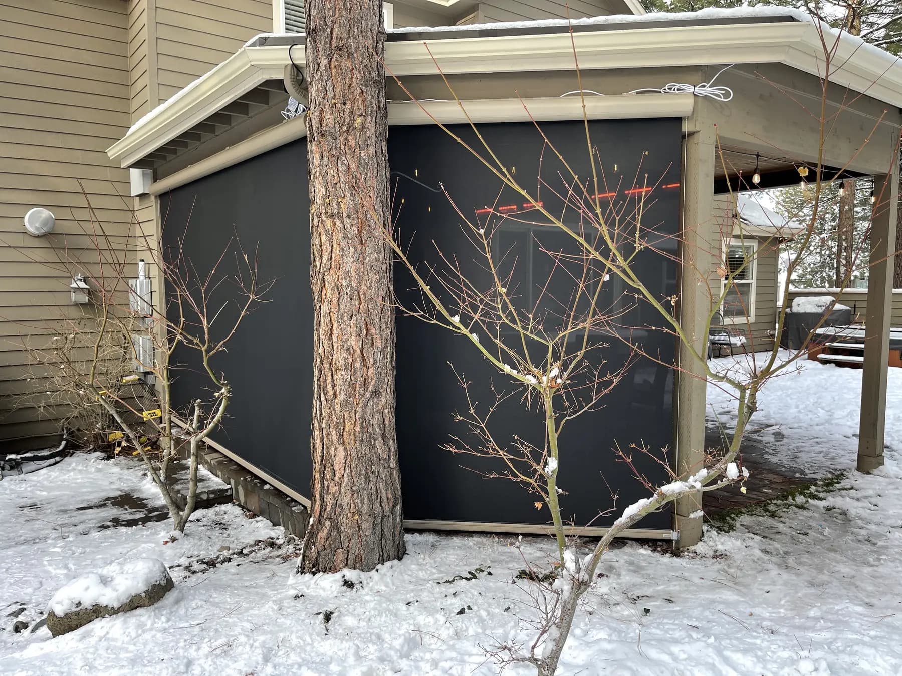 Exterior screens installed around a patio during winter