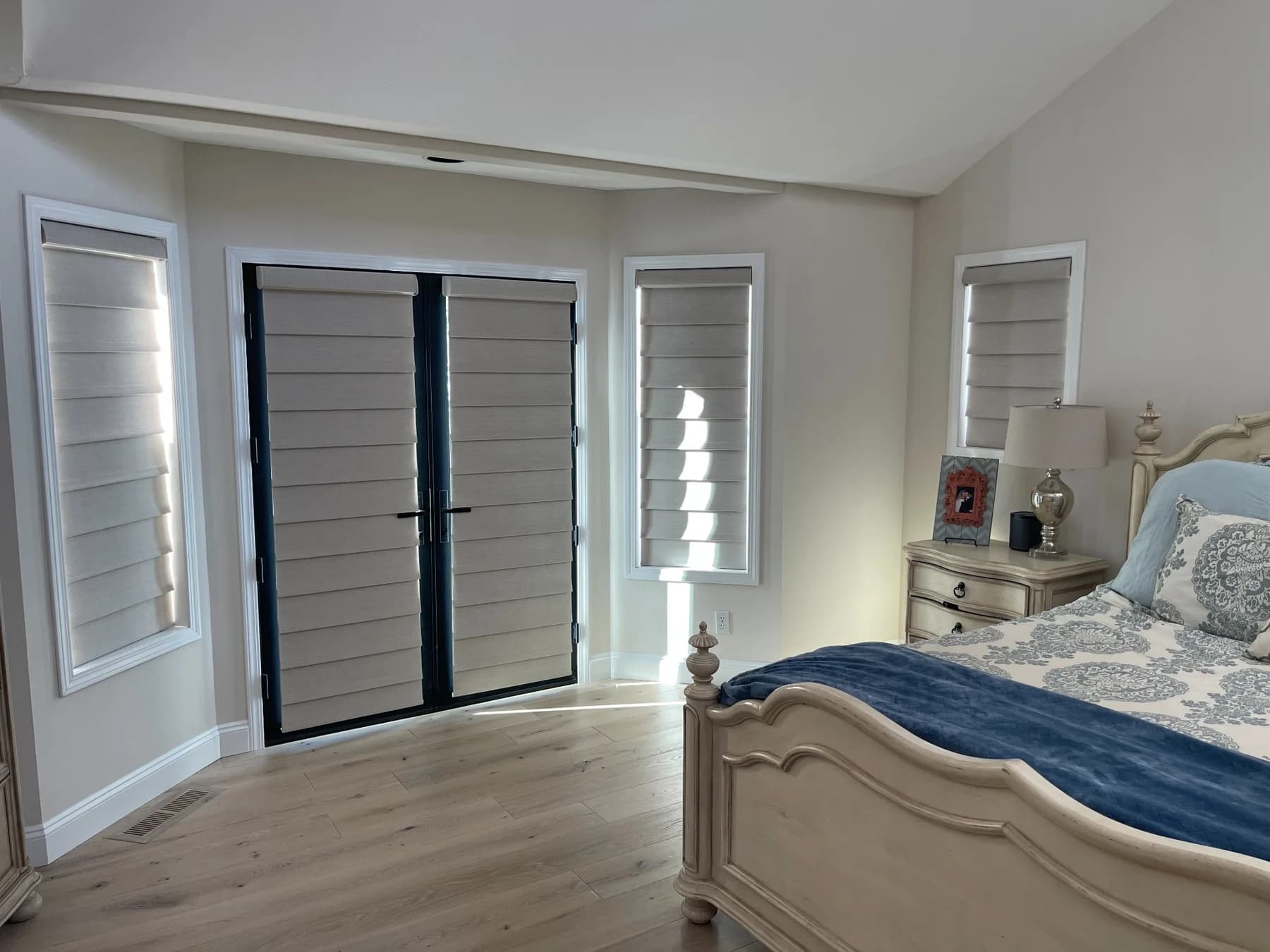 Hunter Douglas shades on bedroom windows and French doors