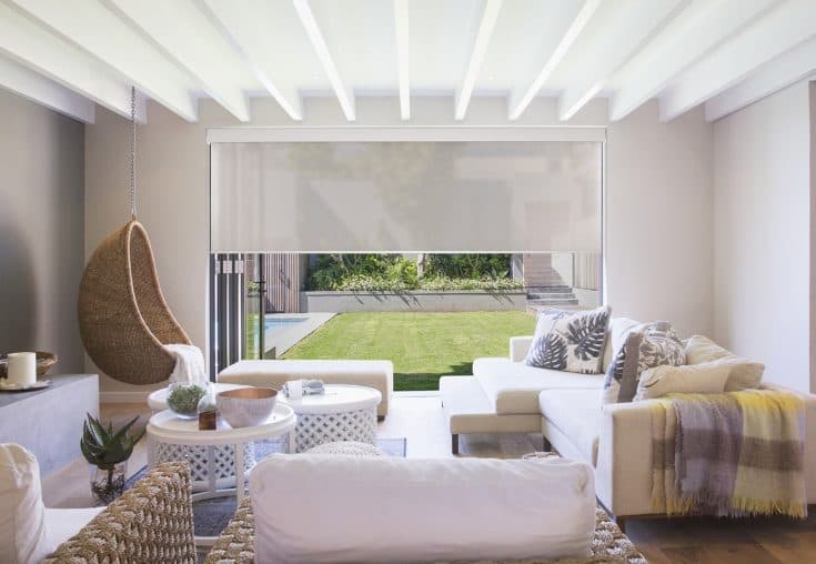 TWO Colourvue roller shades in a bright contemporary living room