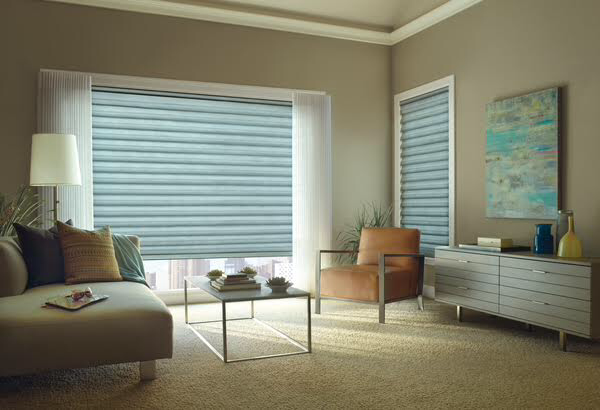 Blue-gray transitional sheer shades in a modern living room, ideal for motorized window treatment systems in Coeur d'Alene homes