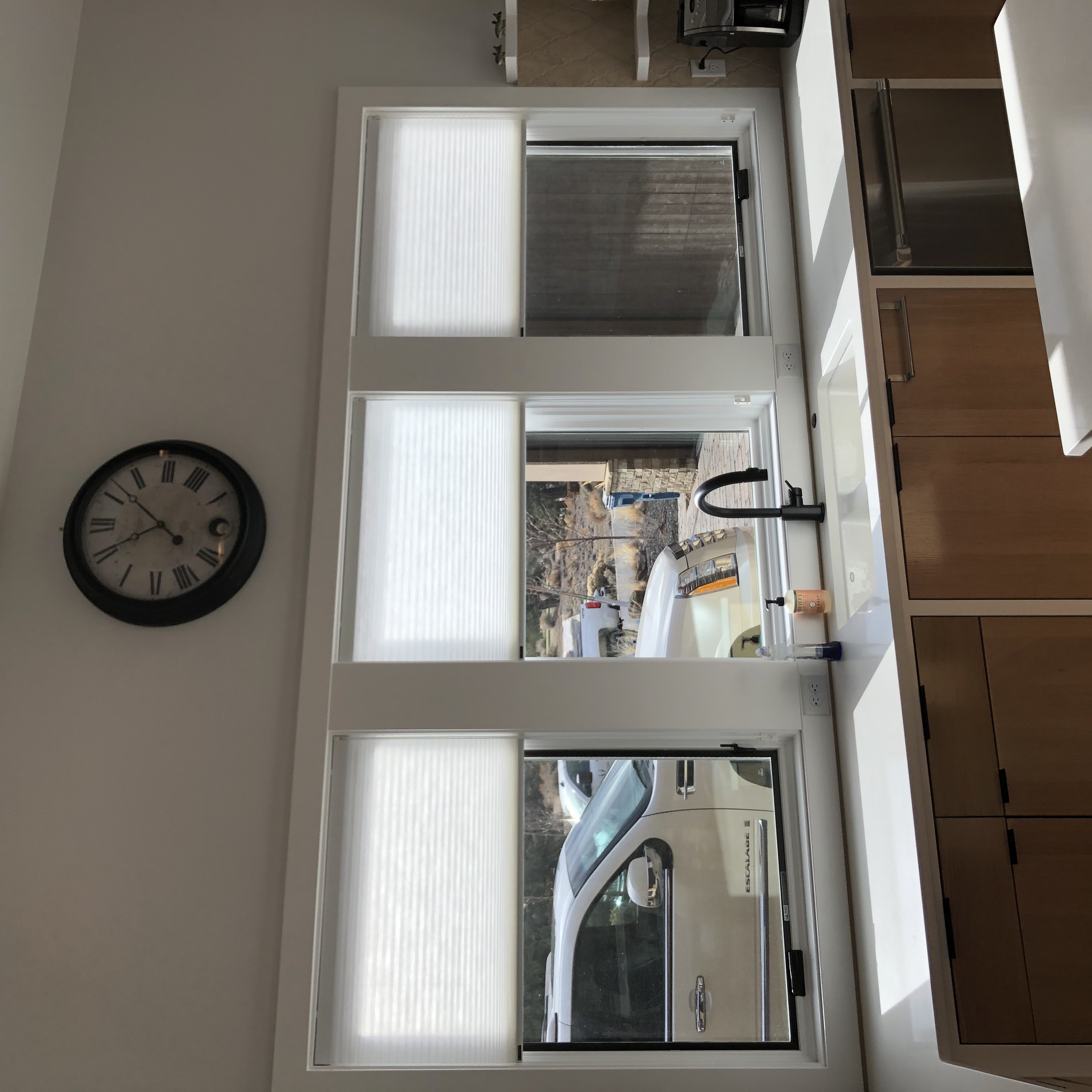Battery-operated motorized shade installation in a northern Idaho home showing wireless control setup