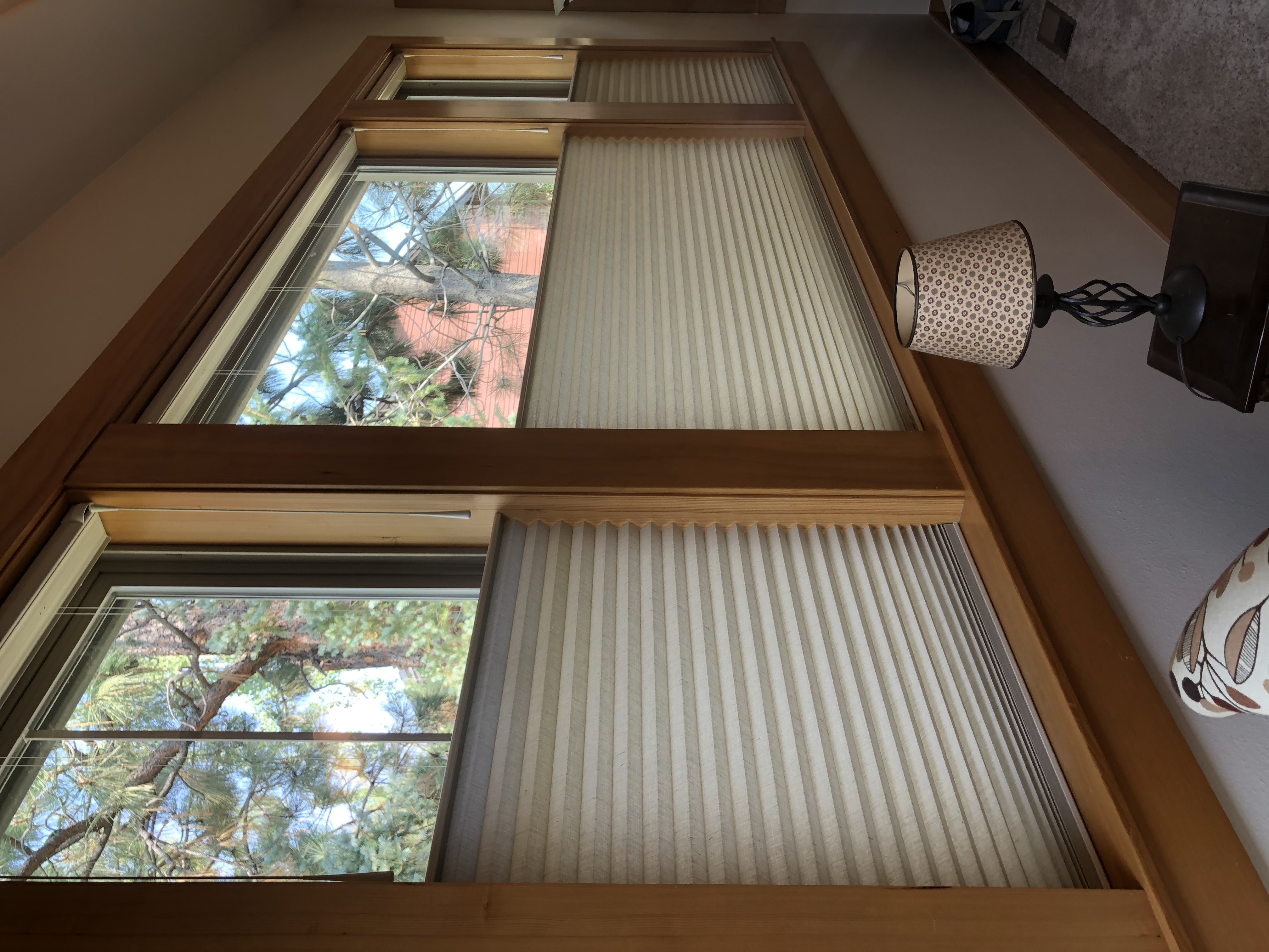 UV-blocking solar shades protecting a north Idaho home interior from sun fading and heat gain