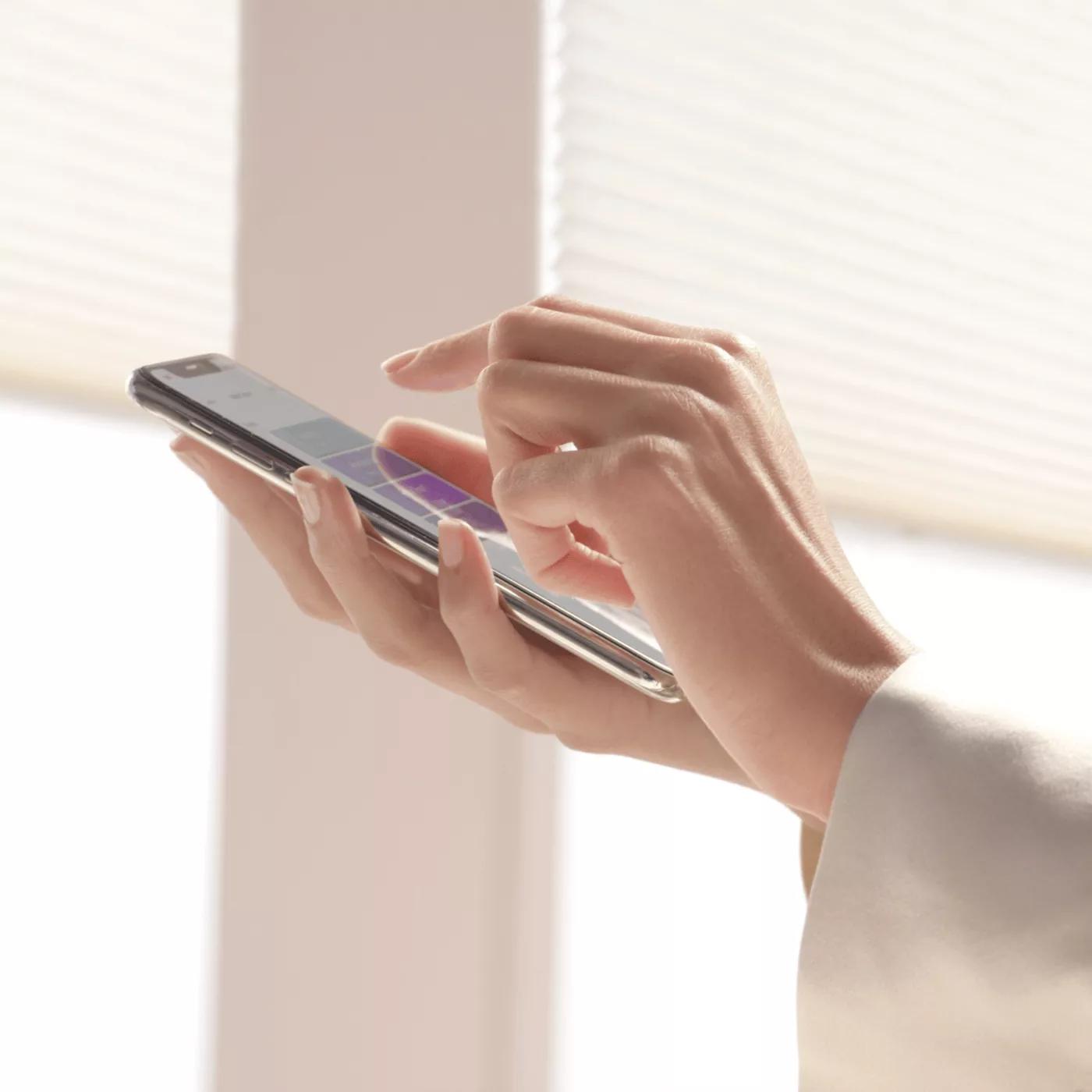 Person using the PowerView app on a mobile device